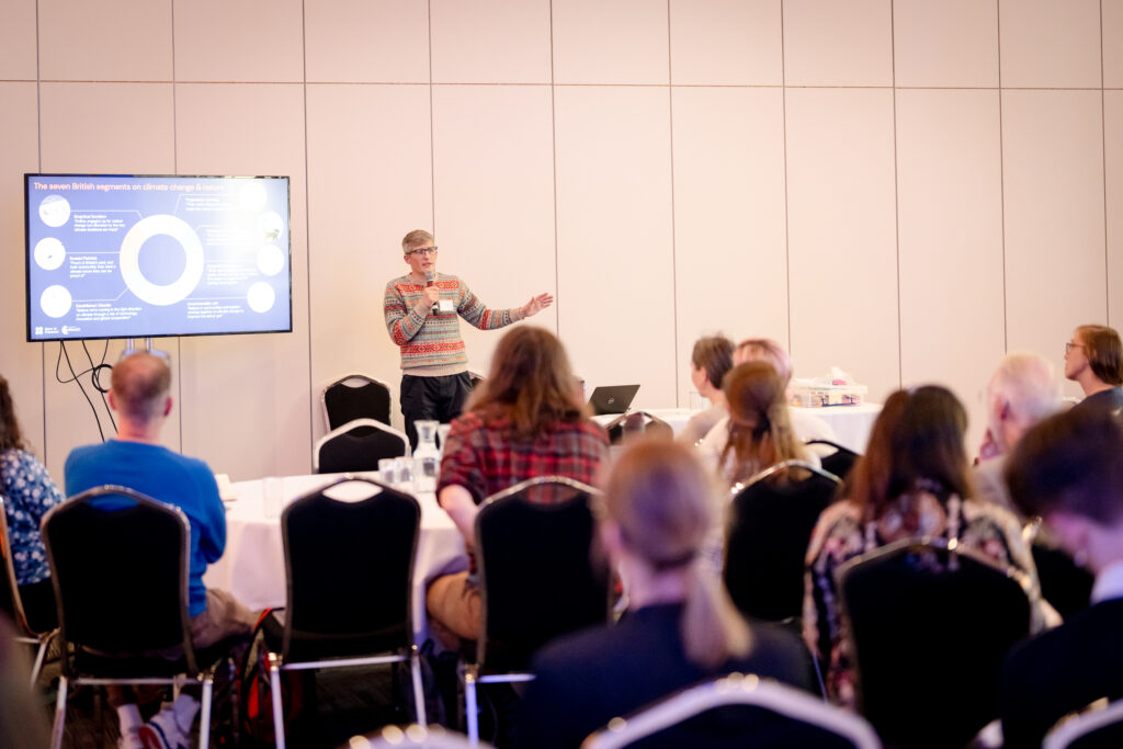 A MACC Hub member presents a workshop session while delegates listen to the presentation.
