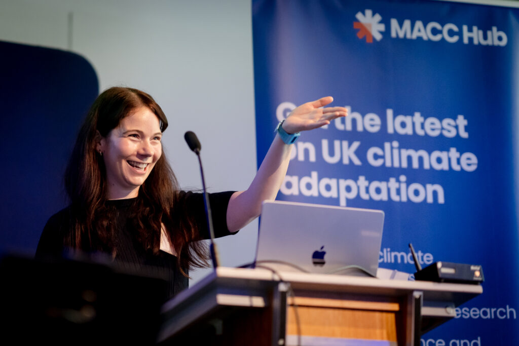 An early career researcher shares their project with attendees during a MACC Hub conference session.