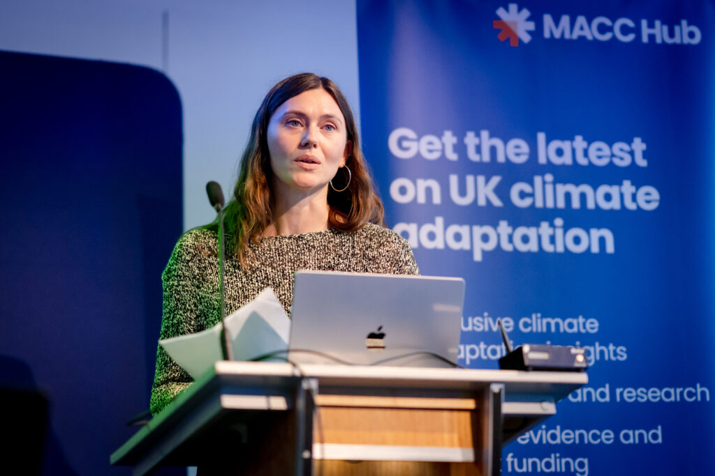 An early career researcher shares their project with attendees during a MACC Hub conference session.