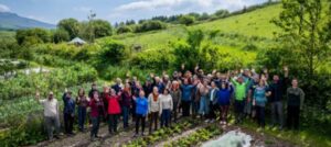 Image of people standing together on a field at Henbant