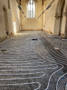 The replacement underfloor heating being installed at Becket's Chapel. @ Historic Norfolk