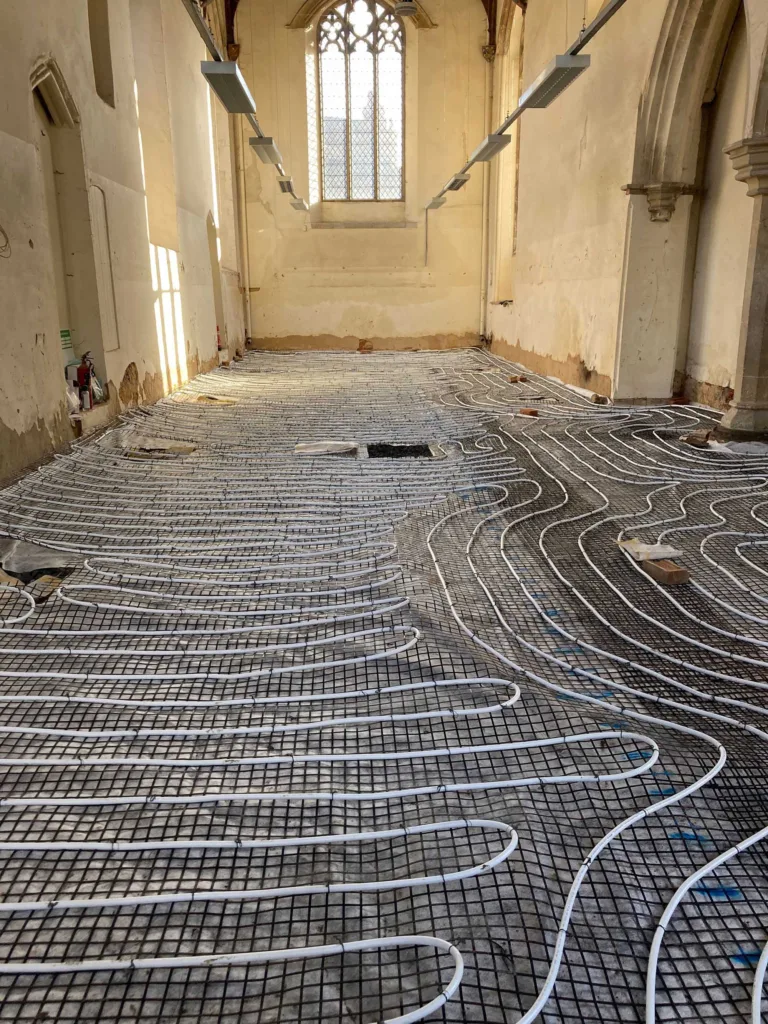 The replacement underfloor heating being installed at Becket's Chapel. @ Historic Norfolk